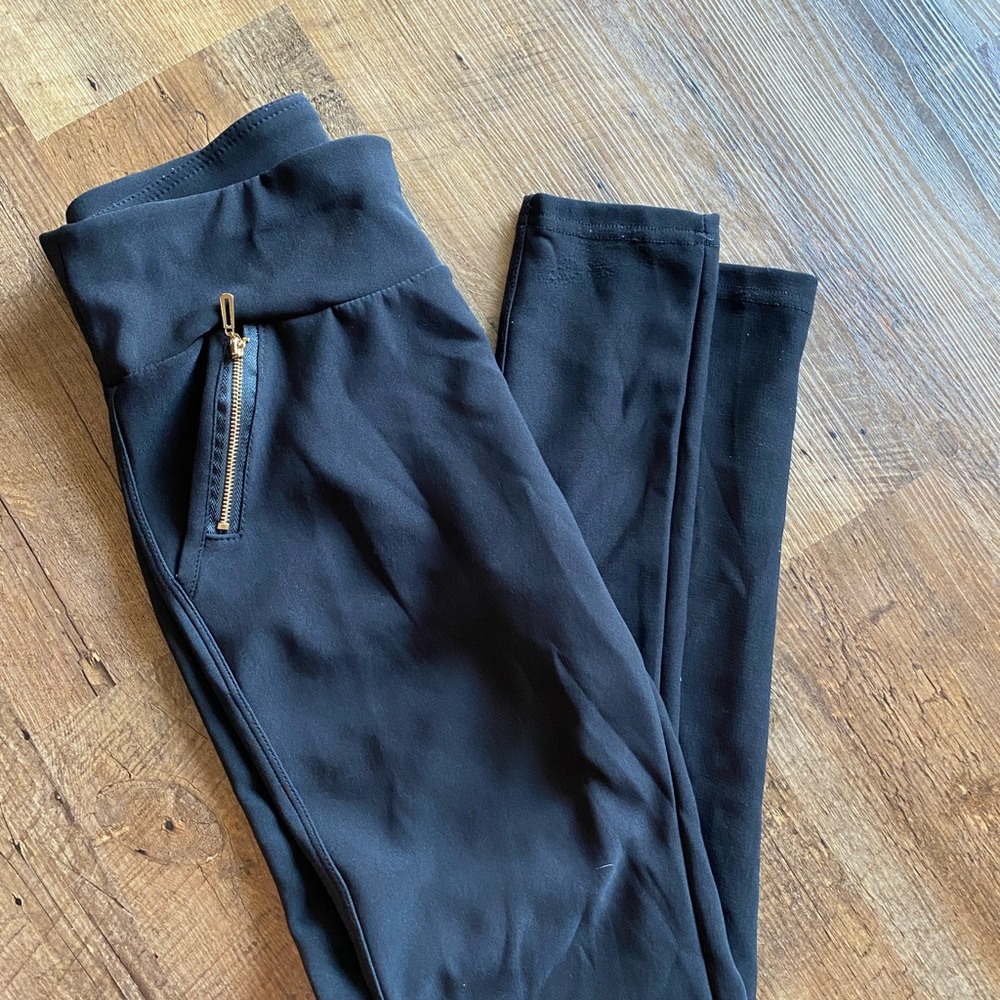 Black stretch dress pant with zipper pockets